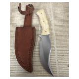 Knife with leather case feels like bone handle
