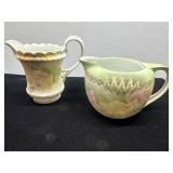 Two Decorative Porcelain Creamers with Floral Desi