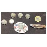 Pins, USA Belt Buckle, and Pocket Knife on Display