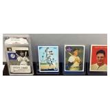 Four Baseball Cards in Protective Sleeves
