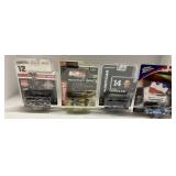 Four IndyCar Die-Cast Model Cars in Original Packa