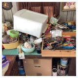 Table With Assorted Contents and Tools