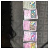 5 Pokemon Cards in Plastic Sleeves