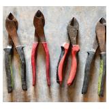 Four Metal and Plastic Handle Pliers