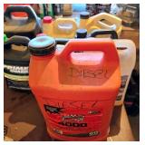 Various Used Automotive Fluids in Opened Container