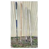 Four Garden Rakes with Various Handles