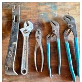 Five Hand Tools Including Wrenches and Pliers