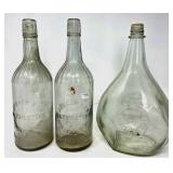 Three Vintage Embossed Glass Bottles