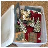 Clear Plastic Bin of Holiday-Themed Decorations