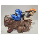 Ceramic Boy on Log