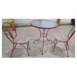 Glass Top Table and Metal Chairs