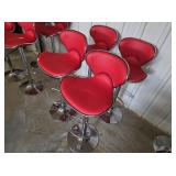 Four red bar stools