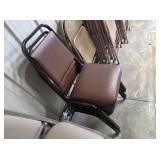 Four brown stacking chairs