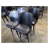 Four black bar stools