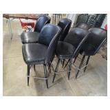 Six black bar stools