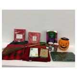 Two Christmas Mugs, Two Boxes of Stationery, Tablecloths, Halloween Decoration, and Witch