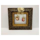 Ornate Frame with Festive Ornaments Hanging from Ribbons