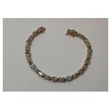 Gold Wash Sterling Silver Multi Blue Topaz Gemstone 7 in. Hugs and Kisses Tennis Bracelet