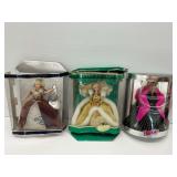 Three Barbie Dolls in Original Packaging.