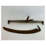 Agricultural Tools Including a Wooden Evener and a Metal Scythe Blade