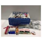 Assortment of Craft Supplies: Ribbons, Mesh, and More in Storage Tub