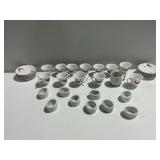 Porcelain Teacups, Saucers, and Ceramic Napkin Rings