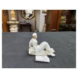 Ceramic Figurine of Woman on sled