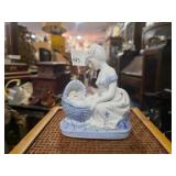 Porcelain Figurine of Mother watching over infant
