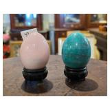 Two Polished Stone Egg Figures on Stands
