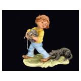 Bisque Porcelain Boy with Puppies Figurine