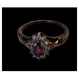 Vintage 10K Gold Ring; central ruby surrounded by small stones; size 5.5; weight 2.34 grams