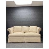 Cream Colored Upholstered Sofa