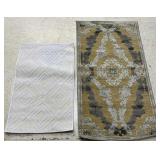 Two Small Sculptured Rug Mats