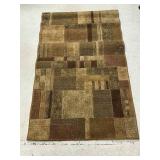 Brown, Tan, Beige and Cream Colored Rug