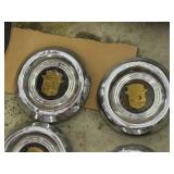SET OF VINTAGE CADILLAC HUBCAPS