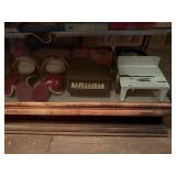 CONTENTS OF BOTTOM SHELF OF DISPLAY CAS