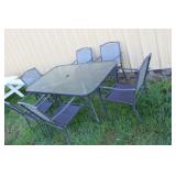 61 X 38 GLASS TOP PATIO TABLE & 6 CHAIRS