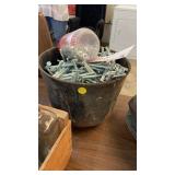 CAST IRON POT OF BOLTS AND NUTS