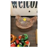 Pink glass hen on nest