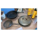 TWO CAST IRON SKILLETS, LID IS GRISWOLD