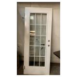 Door with grids in between glass