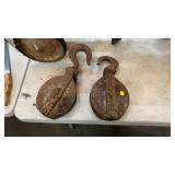 TWO LARGE METAL PULLEYS