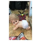 Baby doll and eagle figure