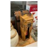 TWO DECORATIVE BOTTLE HOLDERS