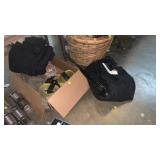 Box of tie downs, ski gear, wooden bat, etc