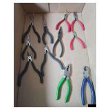 Collection of needle nose pliers and side cutters
