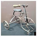 Small metal tricycle.