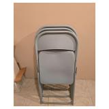 Three metal folding chairs