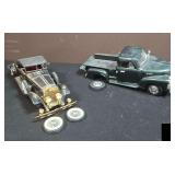 Pair of Models. Both have tires that are present and need to be reattached.