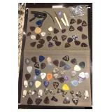 Collection of banjo and guitar picks and parts